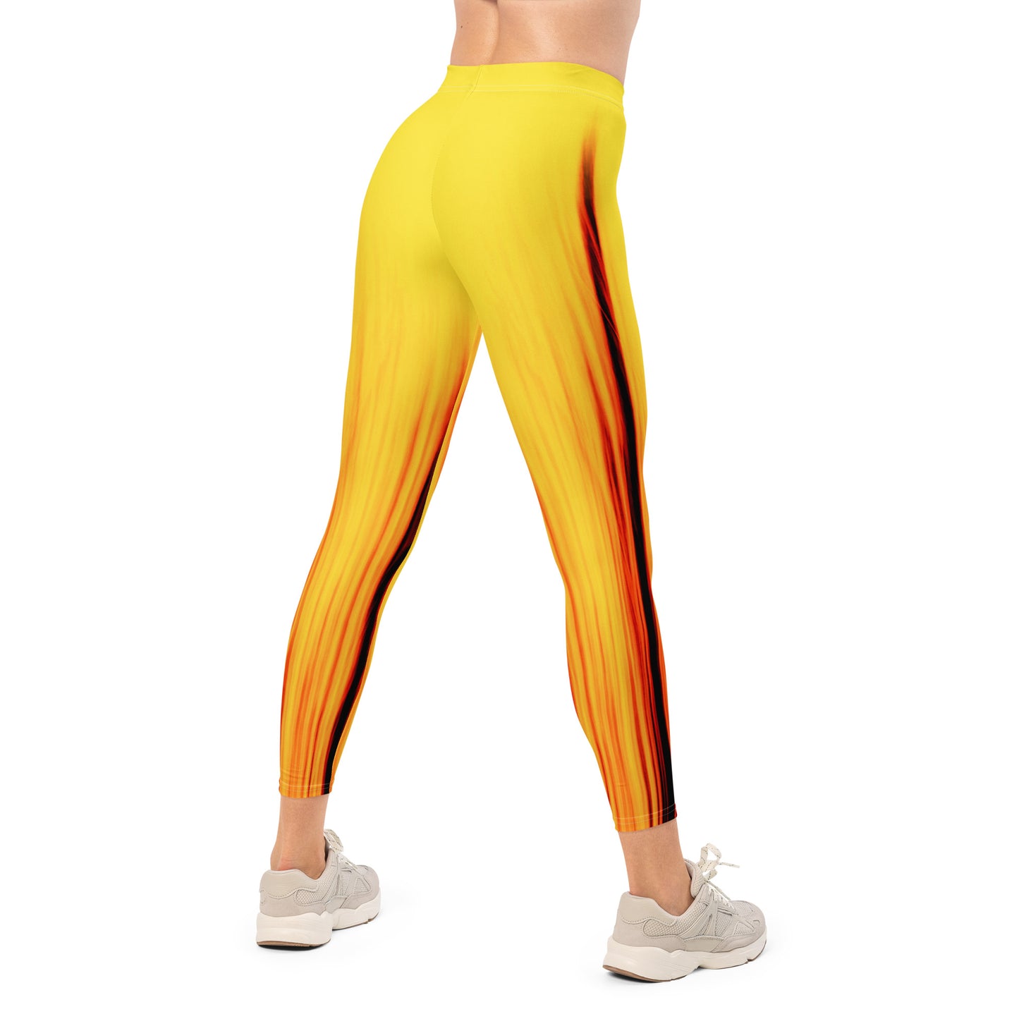 Eine Frau trägt die Moving Forest One Yellow Red Mid Waist Damen Leggings von Bachblatt. Ansicht von hinten.